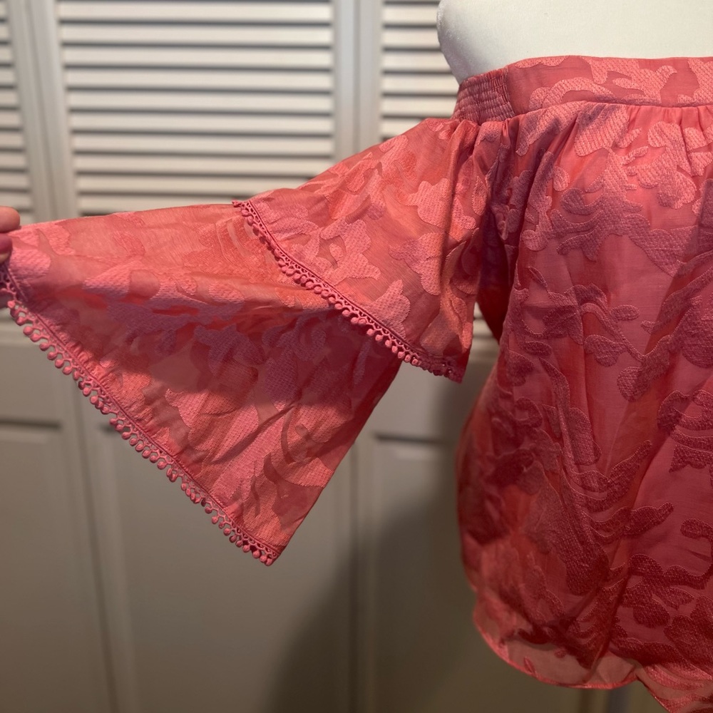 Off-the-shoulder pink blouse